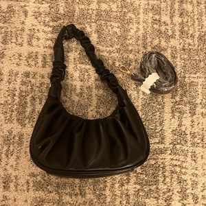 Black Bloomingdale’s aqua bag. Excellent condition with crossbody strap .